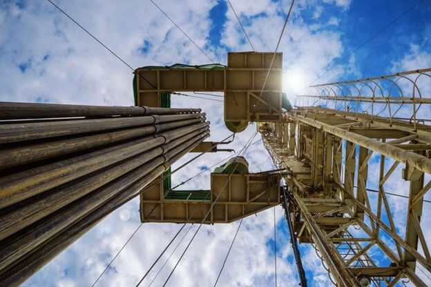 Upward view of oil site utilizing friction reducers for drilling.
