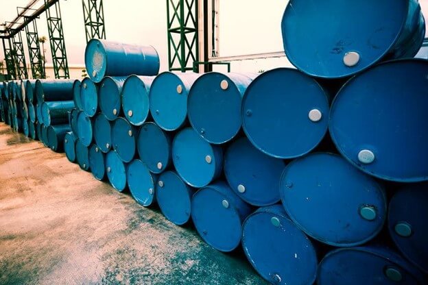 oilfield drums stacked and filled with drilling fluids.