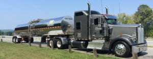 bulk liquid tanker carriers delivering chemical freight on grass