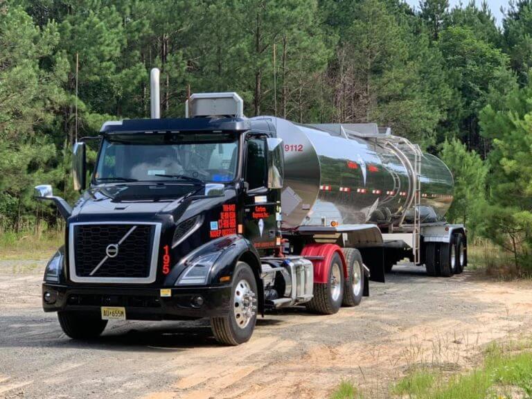 Chemical Trucking Companies Driving Chemical on dirt road