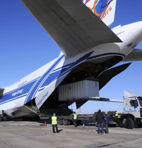 Baikonur, Kazakhstan - November 11, 2013: Russian Volga-Dnepr Antonov AN-124 long-range heavy transport plane is being unloaded in Yubileiny airport.